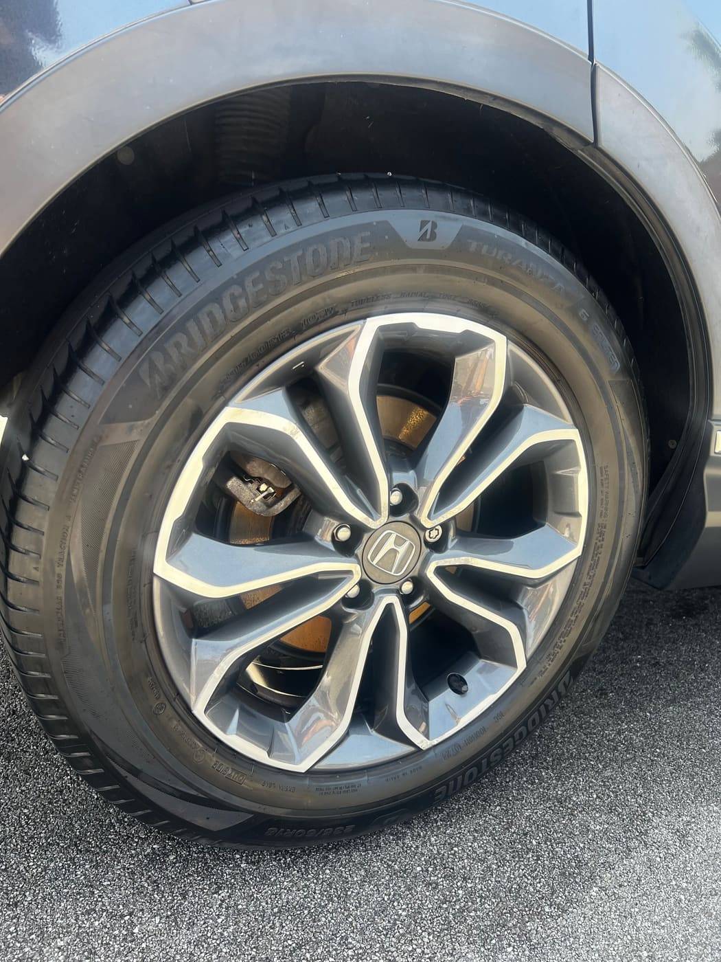 Alloy wheel after cleaning, with the tyre cleaned and dressed