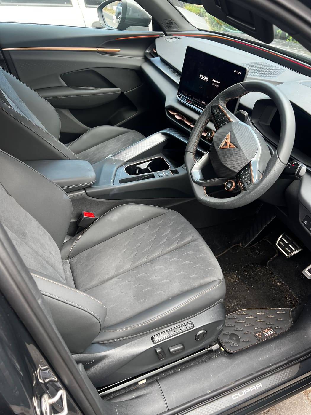 Cupra front cabin before cleaning, dust across the dash and seats