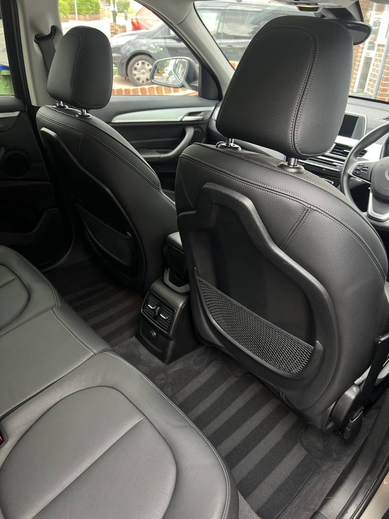 Spotless BMW rear seats and carpets kept fresh by regular maintenance valeting